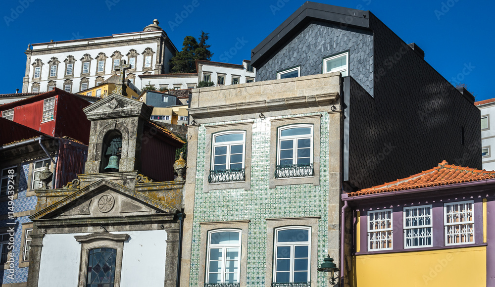 Twonhouses and small Lada Chapel and houses in Ribeira district, Porto, Portugal