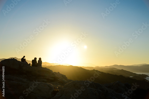 People silhouettes at sunset