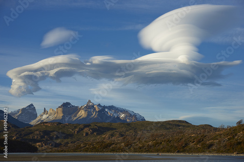 Lenticular clouds over the mountains of Torres del Paine National Park in Patagonia, Chile photo