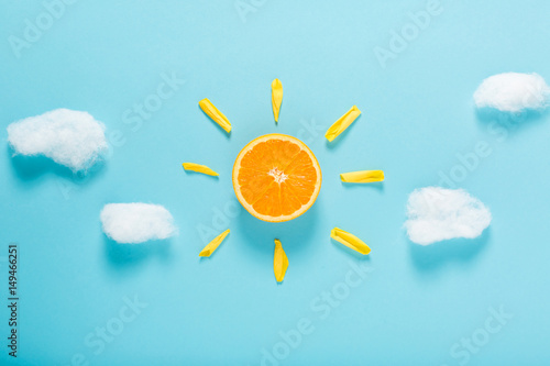Orange slice as the sun concept