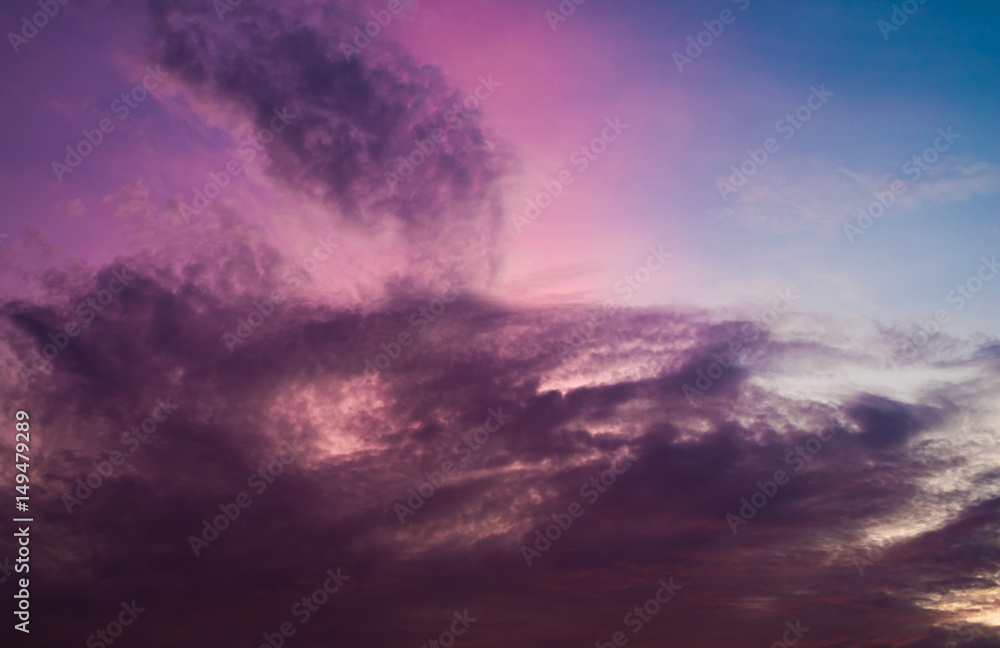 Sunset in violet, orange and blue sky with roof and antenna