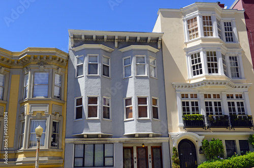 Tightly packed bright colorful houses on steep angled streets in San Francisco California