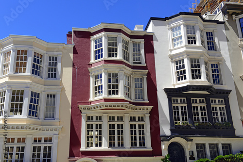 Tightly packed bright colorful houses on steep angled streets in San Francisco California
