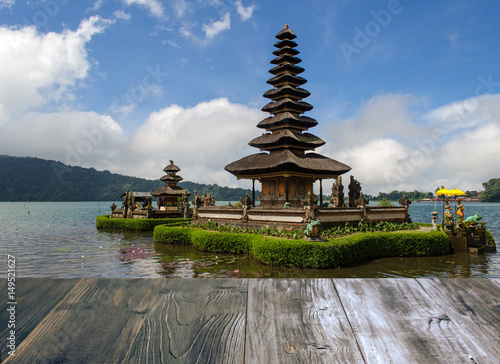 vintage wood terrace with view of Pura Ulun Danu Batur is hindu temple at Bratan lake in Bali  Indonesia  soft focus  selective focus  copy space.