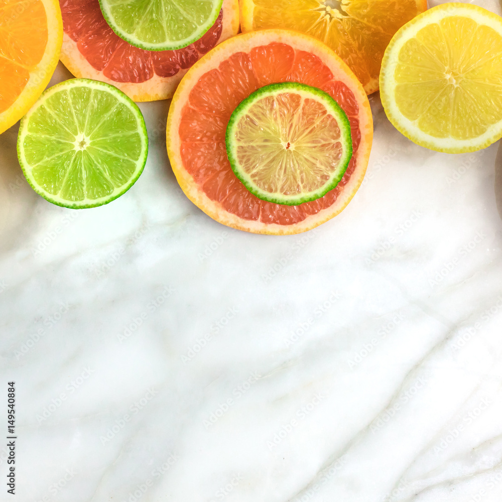Grapefruit, lime, lemon, and orange slices with copyspace Grapefruit, lime, lemon, and orange slices with copyspace