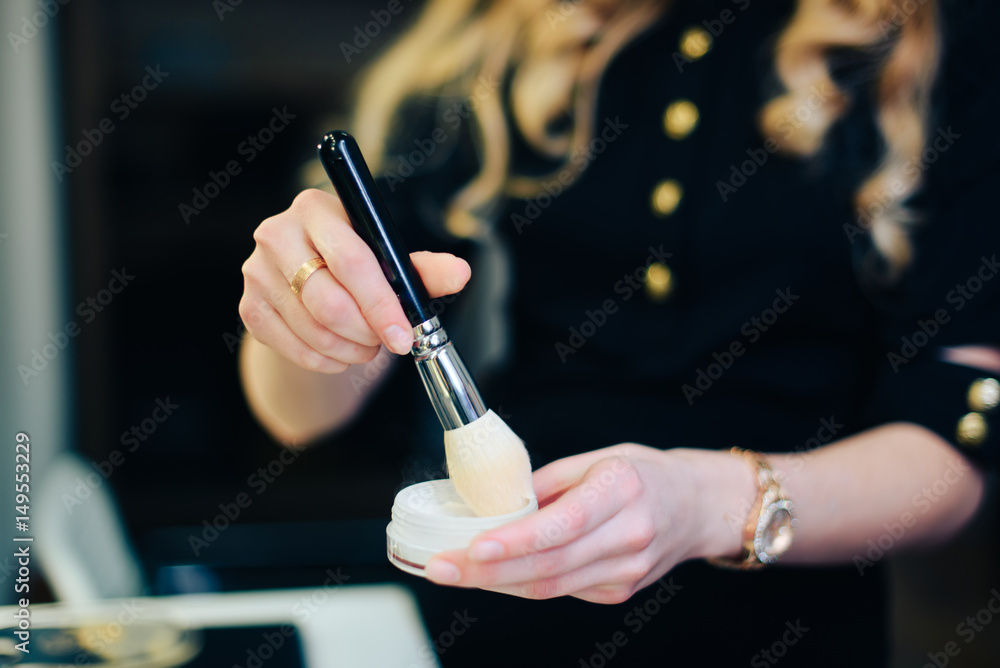 stylist working in a beauty salon and a nice lady stylist working in a beauty salon and a nice lady