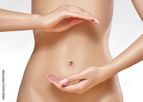 Beautiful female belly. Pretty woman cares stomach. Healthcare, digestion, intestinal health. Wellness, spa. Body part photo