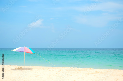 Fototapeta Naklejka Na Ścianę i Meble -  Pastels colors umbrella on the white sand beach in Kata beach Phuket Thailand