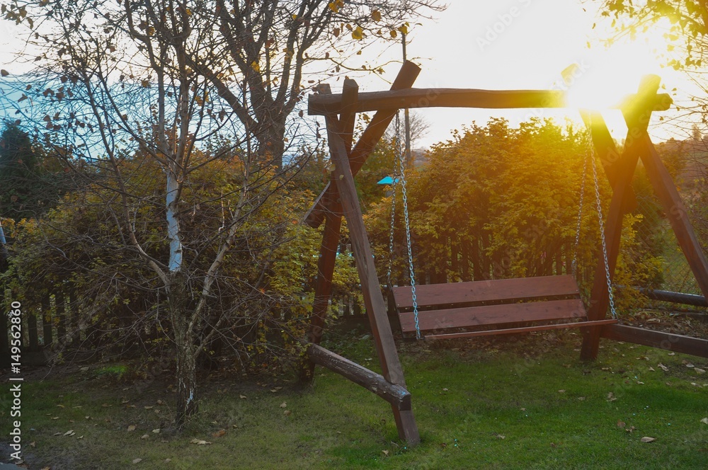 Fototapeta premium Swing in the garden at the end of the world.