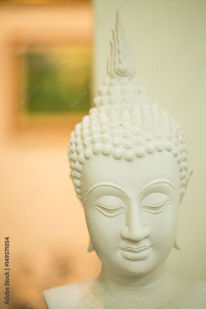 Head of Buddha in living room.
