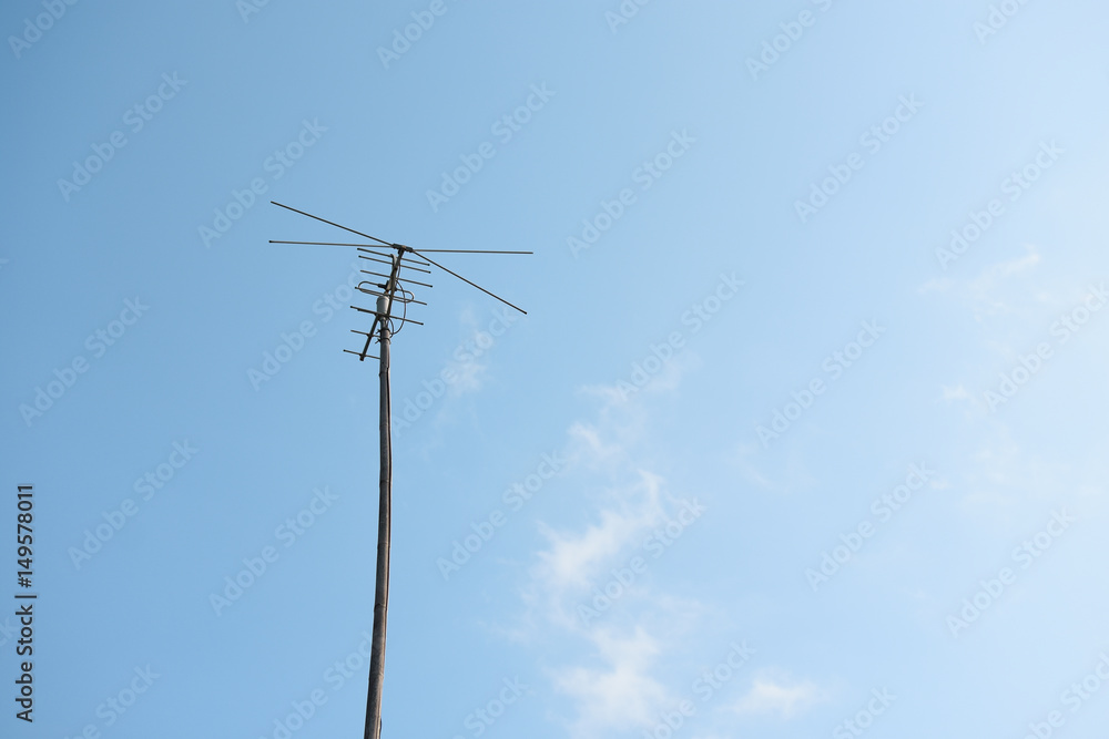 Television antenna with blue sky background. Television antenna with blue sky background.