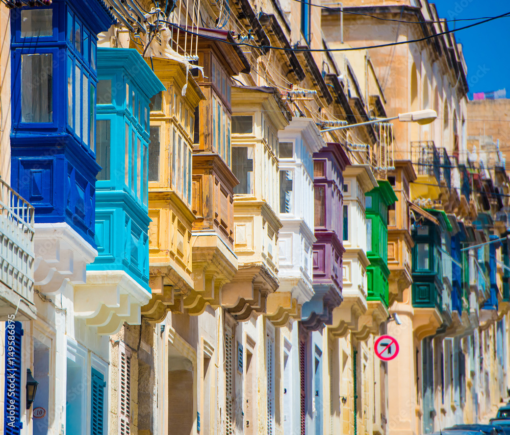 street with colorful balconies in historical part of Valletta in Malta - obrazy, fototapety, plakaty 