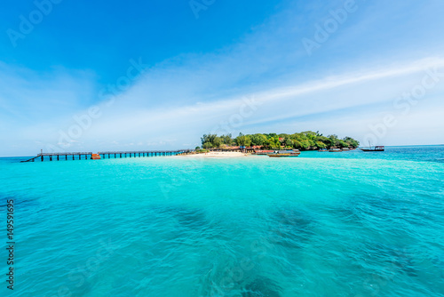 Fototapeta Naklejka Na Ścianę i Meble -  colorful seascape with african island on the horizon with turquoise ocean and blue sky