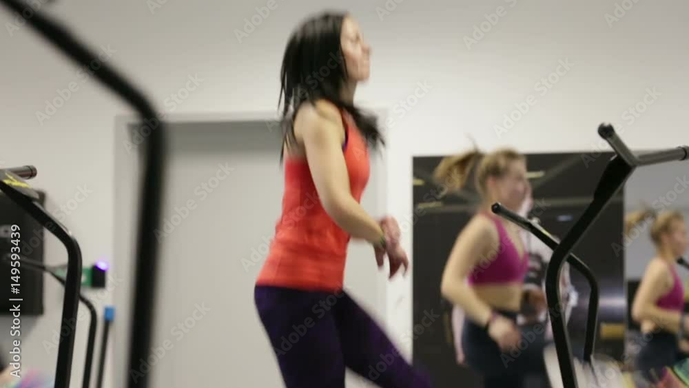 jumping fitness, skyjumping, sky jumping, big jumping, beautiful young girls doing jumping fitness. fitness on trampolines, young girls perform various exercises for a beautiful figure. jumping fitness, skyjumping, sky jumping, big jumping, beautiful young girls doing jumping fitness. fitness on trampolines, young girls perform various exercises for a beautiful figure.