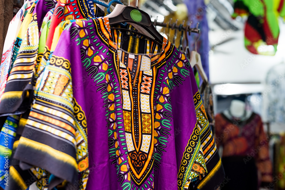 beautiful colorful traditional clothes with patterns at african market