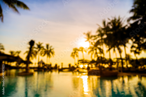Silhouette coconut palm tree around swimming pool © siraphol