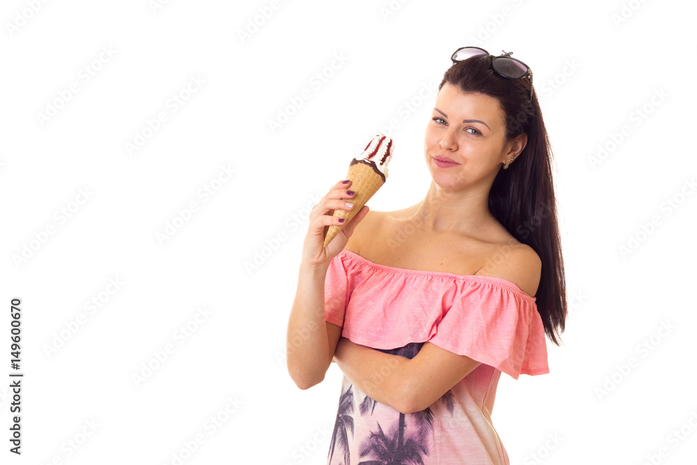 Woman in dress with sunglasses holding ice-cream Woman in dress with sunglasses holding ice-cream
