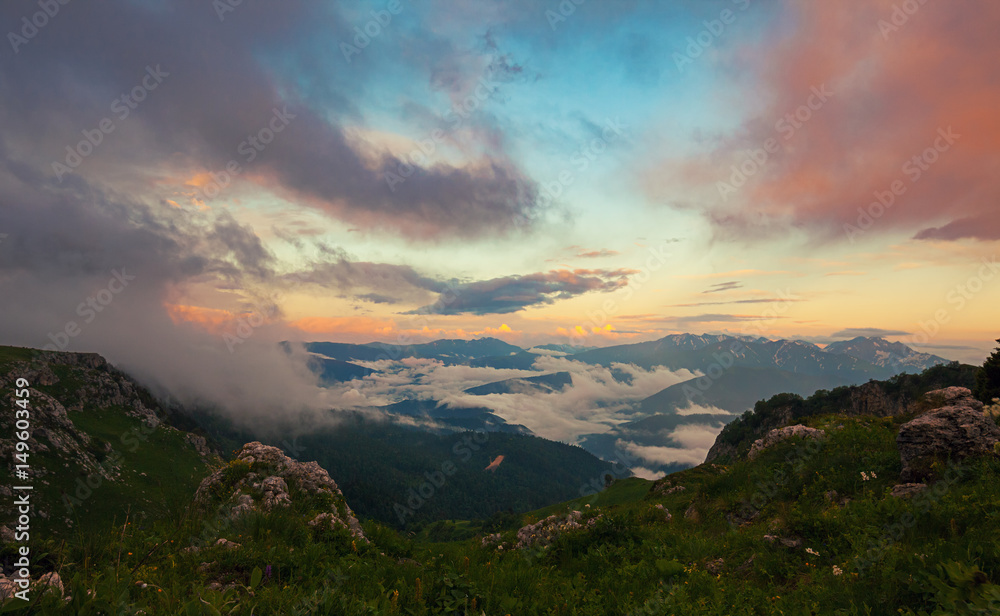 View from above on mountain valley covered with clouds at sunset. Lagonaki, Caucasus, Russia