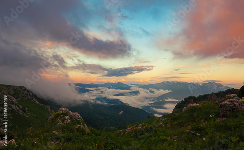 View from above on mountain valley covered with clouds at sunset. Lagonaki, Caucasus, Russia © mikelaptev