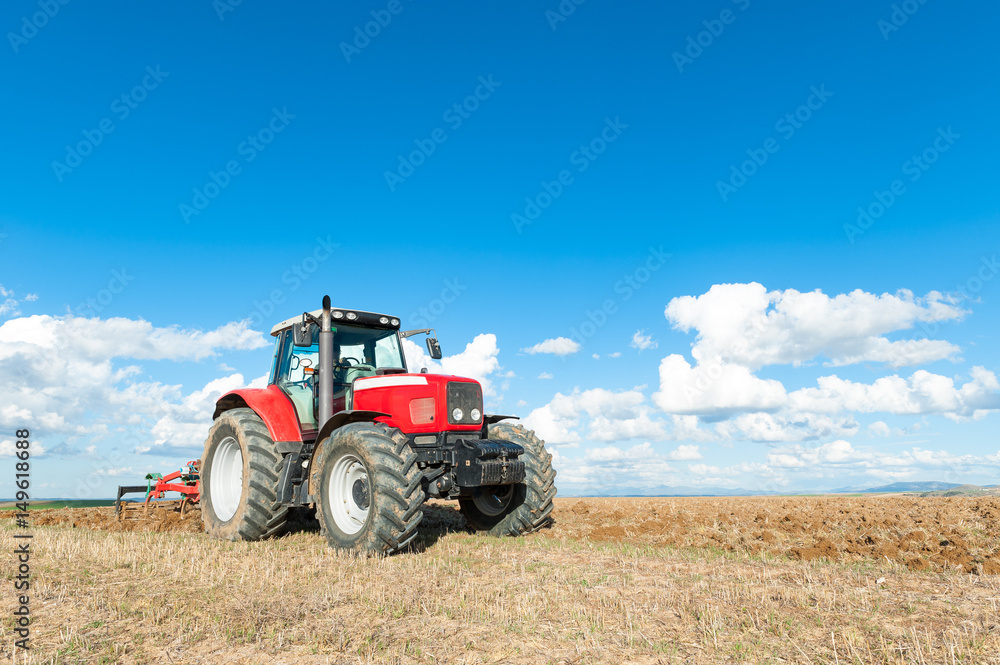 tractor in the lands along with gear for work. tractor in the lands along with gear for work.