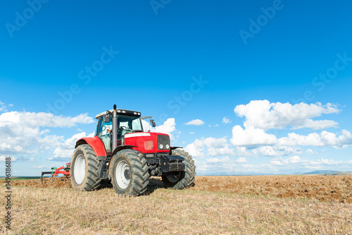 tractor in the lands along with gear for work.