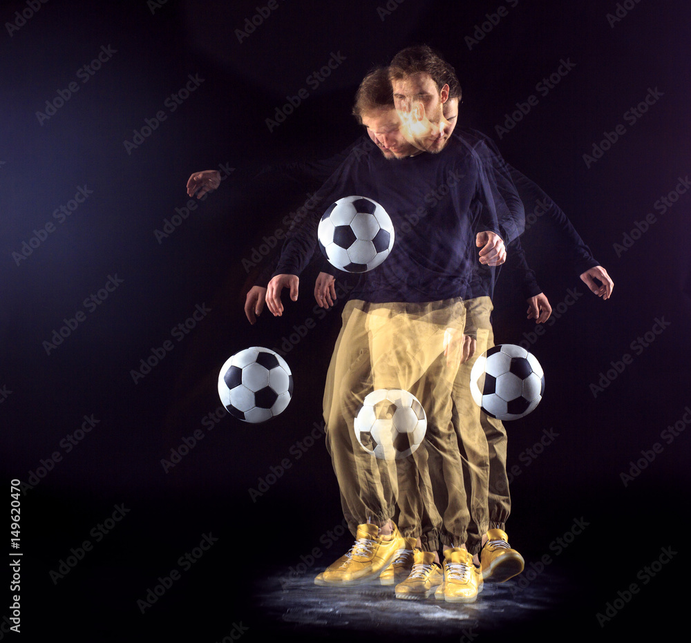A portrait of a fan with ball on gray studio background. Freestile A portrait of a fan with ball on gray studio background. Freestile