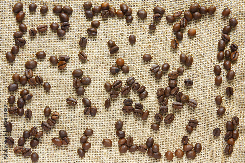 aromatic coffee bean on sackcloth or gunny and top view for cafe or coffee shop drink background aromatic coffee bean on sackcloth or gunny and top view for cafe or coffee shop drink background