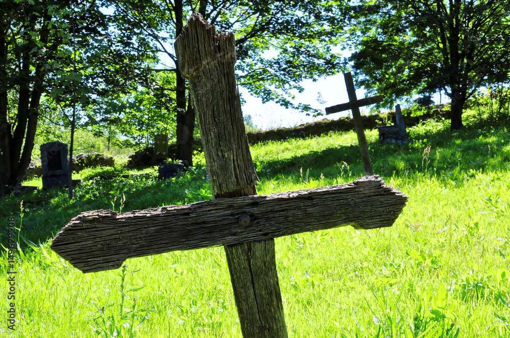 Fototapeta premium Wooden cross in the cementery