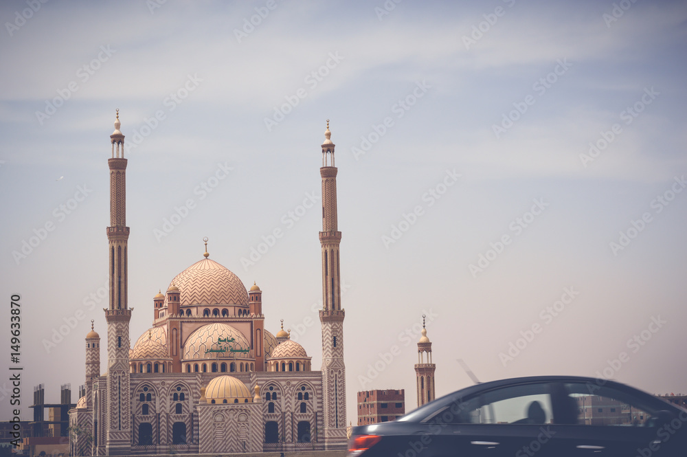 cairo, egypt, may 6, 2017: laylat al-qadr mosque at cairo ismaileya desert road with view of car