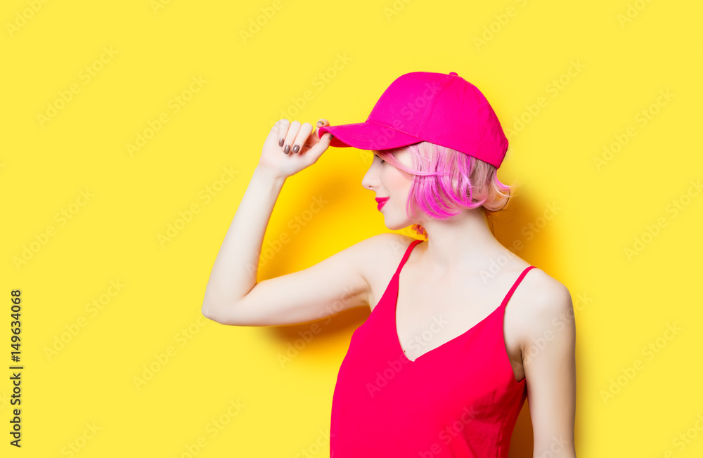 smiling young woman in cap smiling young woman in cap