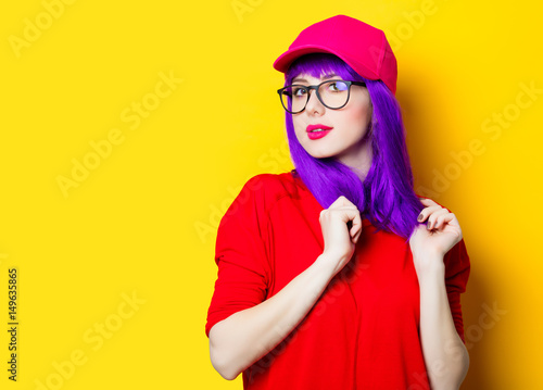 young woman in cap and glasses