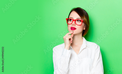 young thoughtful woman in glasses