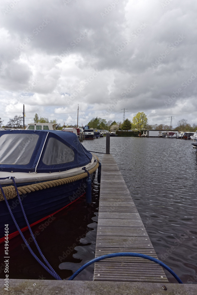 motorboat at the landing stage on a cloudy day