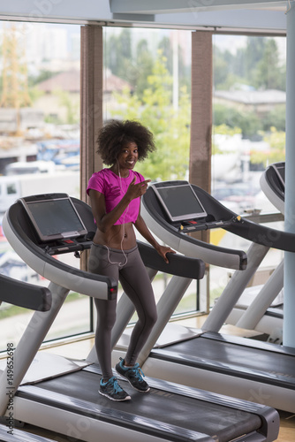 afro american woman running on a treadmill