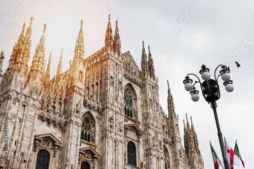 Fototapeta Naklejka Na Ścianę i Meble -  Beautiful Panoramic view of Duomo square in Milan with big street lamp. Italy.