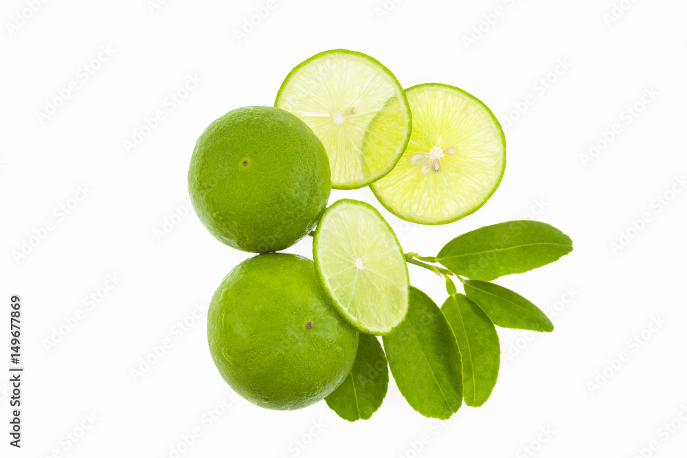 Fresh green limes with slices and leaf isolated on white background.