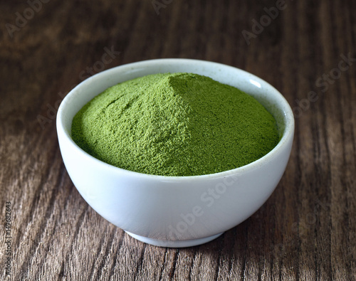 Green tea powder in white bowl