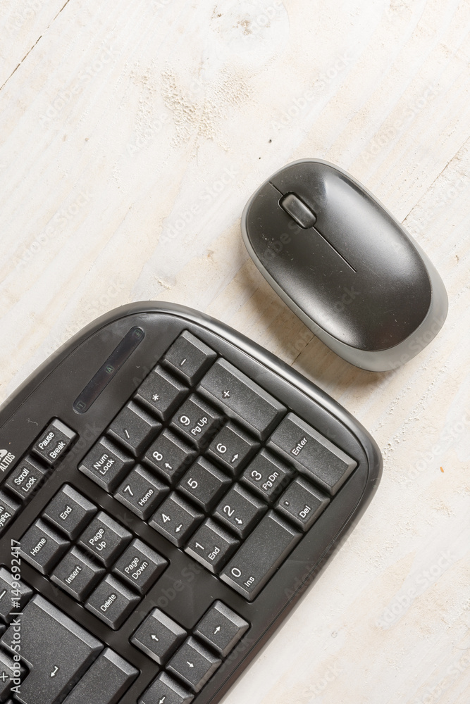 Closeup macro black pc keyboard with black wireless mouse Closeup macro black pc keyboard with black wireless mouse