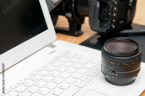 Professional photography editing equipment with camera and laptop