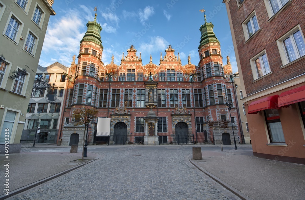 Naklejka premium Ornate facade of Great Armoury in the Old Town of Gdansk at sunrise, Poland