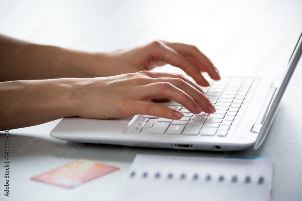 Close-up of hands of businesswoman typing on a laptop. Close-up of hands of businesswoman typing on a laptop.