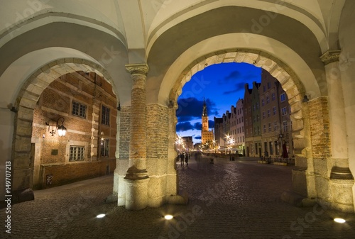 View of Long Market (part of Royal Route) and the main town hall from passage of the Green Gate at night, Old Town of Gdansk, Poland