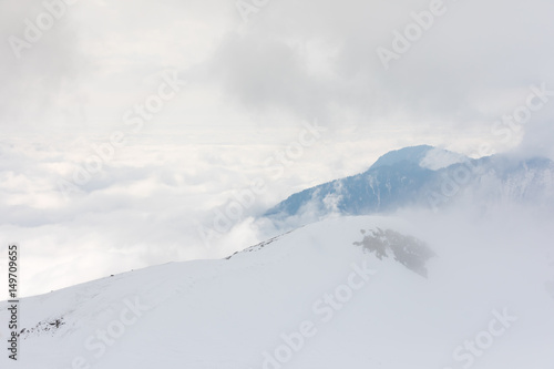 Pure snow in the mountains above the level of clouds