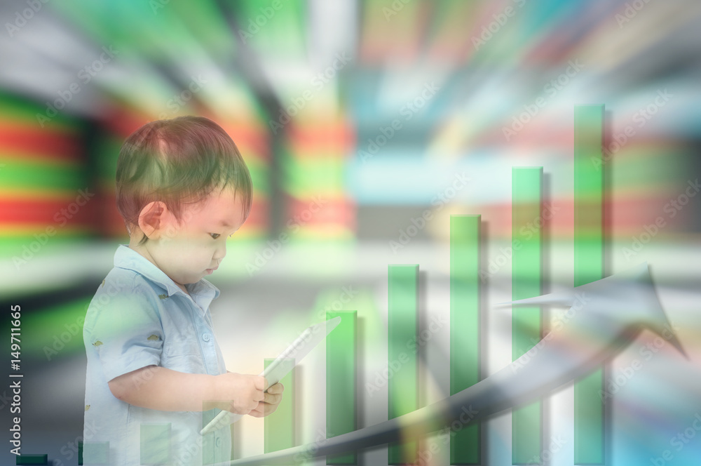 Motion blur of asian kid start to learn about invest with tablet in his hand on blurred stock board background in investment concept Motion blur of asian kid start to learn about invest with tablet in his hand on blurred stock board background in investment concept