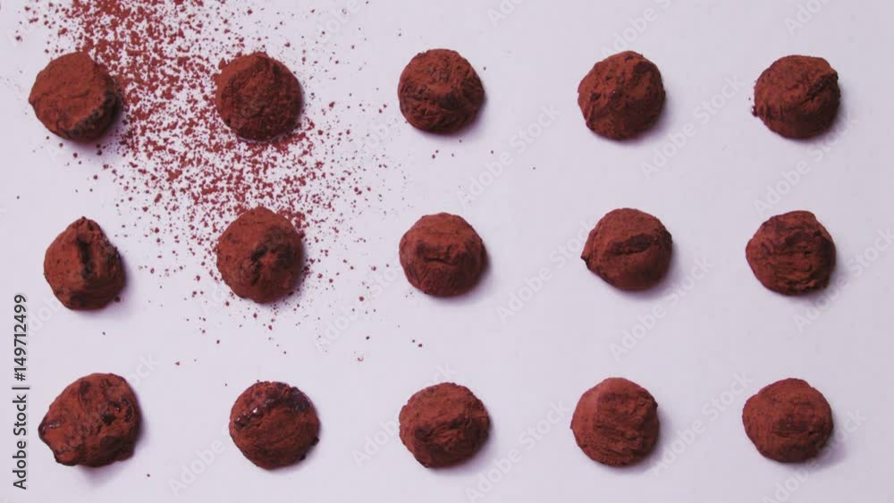 Truffles sprinkled with cocoa. Close-up shot from above Truffles sprinkled with cocoa. Close-up shot from above