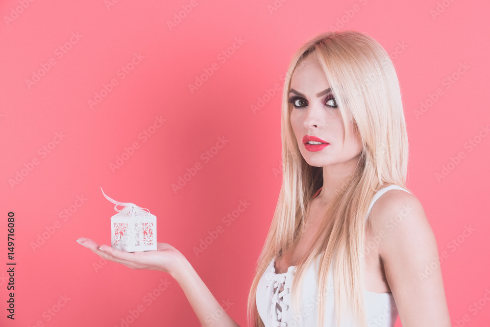 girl or seductive blonde woman hold small white gift box girl or seductive blonde woman hold small white gift box