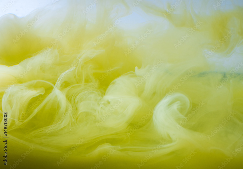 Abstract colored background. Yellow smoke, ink in water, the patterns of the universe. Abstract movement, frozen multicolor flow of paint. Horizontal photo with soft focus, blurred backdrop. Abstract colored background. Yellow smoke, ink in water, the patterns of the universe. Abstract movement, frozen multicolor flow of paint. Horizontal photo with soft focus, blurred backdrop.