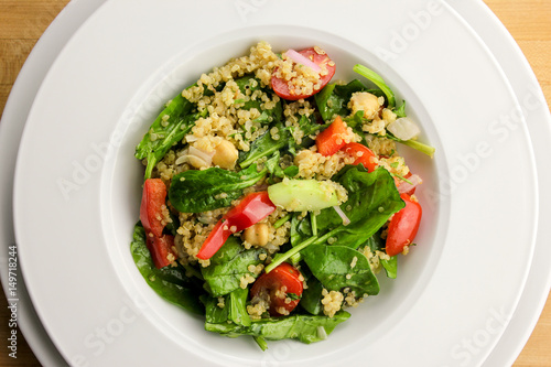 Quinoa salad with spinach, cherry tomatoes and chickpeas