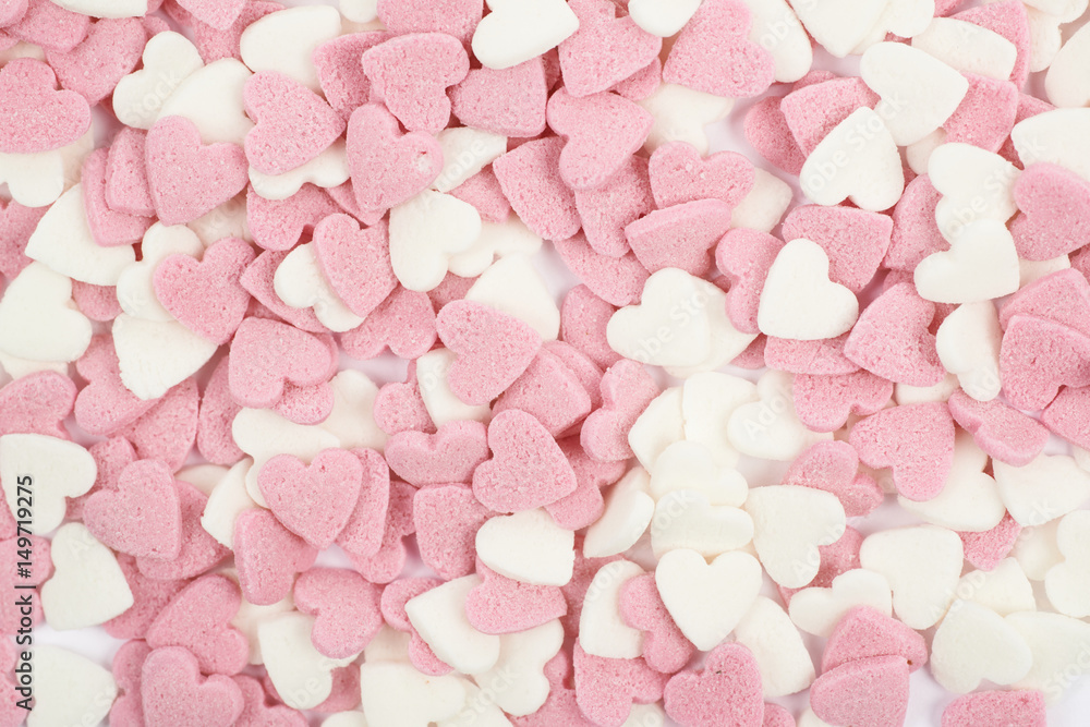 Surface coated with heart shaped sprinkles Surface coated with heart shaped sprinkles