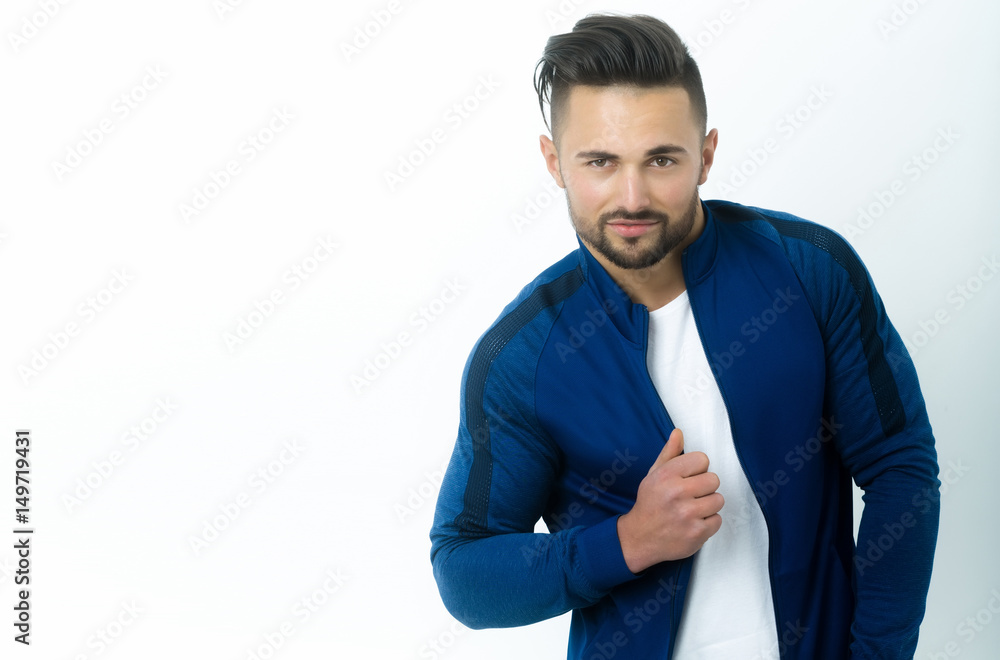 Handsome bearded man in fashionable blue sportswear Handsome bearded man in fashionable blue sportswear